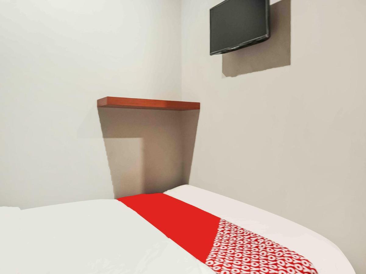 Hotel Capital O 91226 M'kostel Syariah
